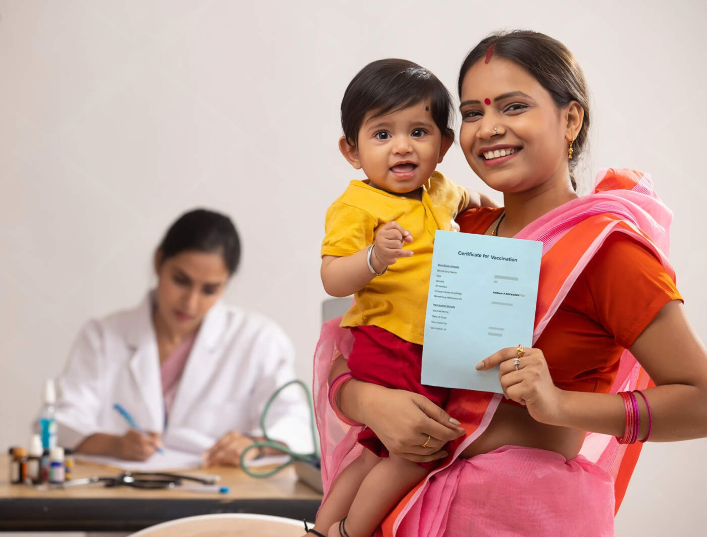 Mother holding her child with vaccination certificate, representing healthcare accessibility